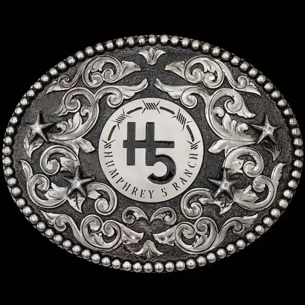 "The Bishop Custom Buckle is crafted on a oval, German Silver base with a matted finish. Detailed with a beaded edge, German Silver scrolls and stars! 

Customize it with your lettering, figure and stones below. Your belt buckle comes with a beauti
